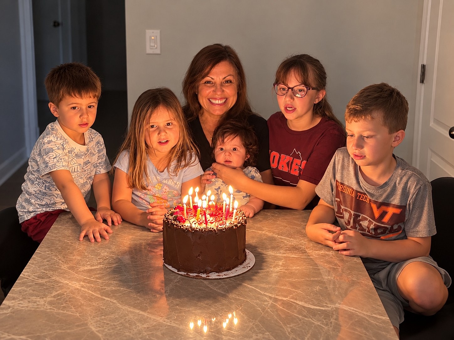 Birthday celebration with family and cake.